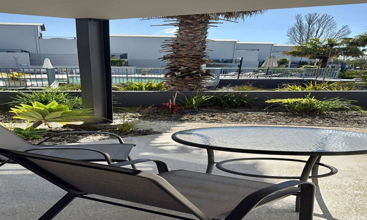 Batehaven Apartment | Relax by the Pool in This Stylish Batehaven Stay