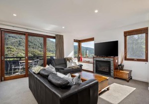 Elevation 2 bedroom with guest room gas fire and mountain views