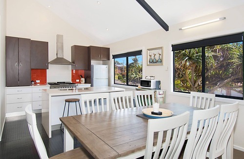 North Creek Apartment | This large and airy tri-level home offers the pinnacle of beachside living