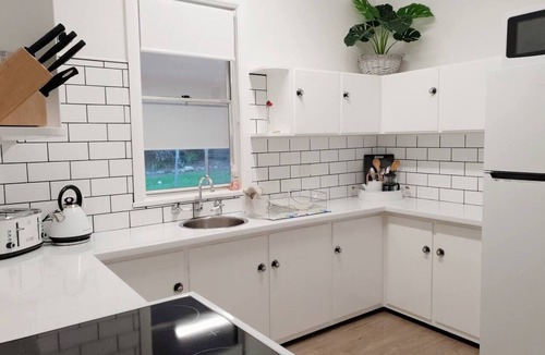Scotts Head House | Beach Bunker: Retro Charm steps to Scotts Beach