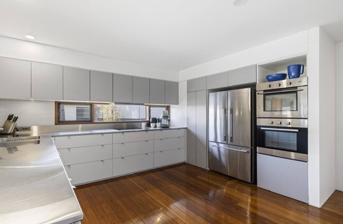 Emerald Beach Apartment | Breathtaking Views, Shared Pool and Yard, Steps from Beach