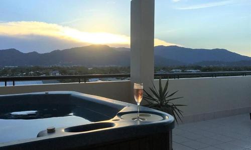 Cairns Apartment | Cairns Penthouse - Private Rooftop Outdoor Gym, Spa & TV Area with Sunset & Mountain Views