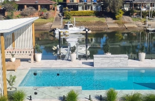 Port Macquarie House | Canal Waterfront Retreat Hosts 10 Pool & Spa