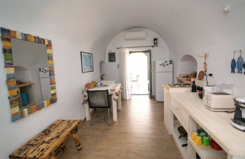 Oia Apartment | Casa Itaca Fireplace Cave Apartment with Private Jacuzzi in Oia, Finikia