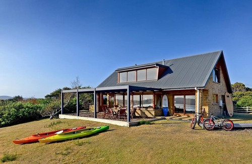 South Bruny House | Cloudy Bay Villa - Cloudy Bay Villa offers visitors a unique experience on secluded south Bruny Island. This spectacular two-story house on a gentle rise over Whalebone Point offers some of the best views in Tasmania.
