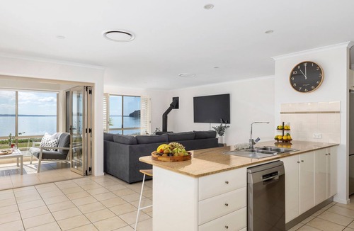 Salamander Bay House | Foreshore Delight offers a tranquil holiday retreat with breathtaking water views