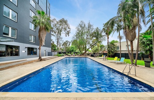Preston Apartment | Fully Furnished Studio Rooms With Included Heated Pool and On-site Restaurant