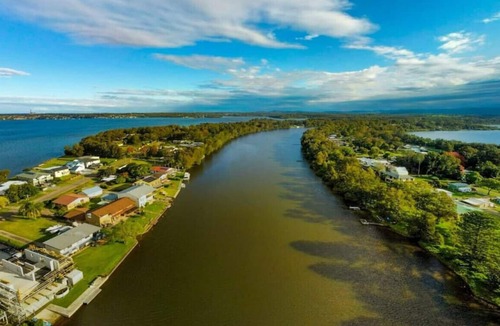 Dora Creek Villa | Lake Palm Retreat - shared pool and waterfront