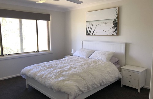 Kareela House | Large modern family home with views of bay and golf course. A quiet nature area