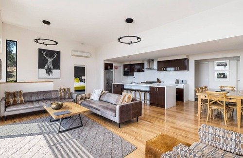 East Jindabyne House | Moongate with beautifully styled, open plan living with panoramic views over Lake Jindabyne