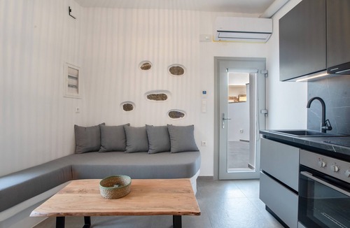 Vivlos Apartment | Naexon Vivlos Stone Escape Apartment with Shared Rooftop, Wi-Fi, and Air Conditioning