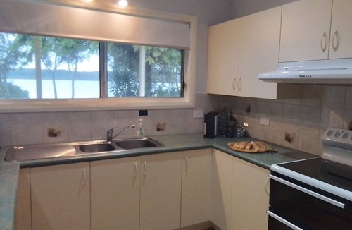 Culburra Beach House | Sanctuary on the Bay - launch your kayak from the yard