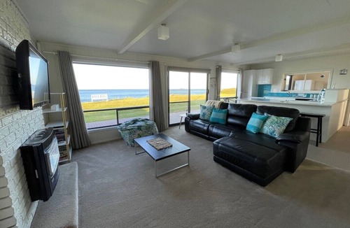 Sisters Beach House | Sandy Shores on Irby - Beach frontage at beautiful Sisters Beach