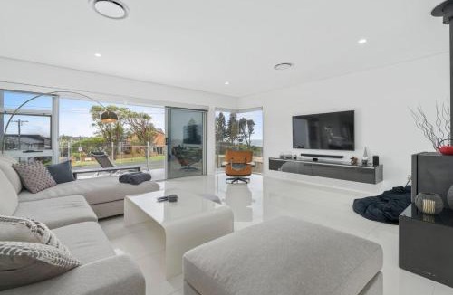 Culburra Beach House | Sea La Vie - Pet Friendly with Fireplace and Swimming Pool & Spa
