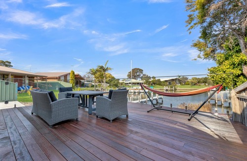 Paynesville House | Step onto the spacious deck and drink in the mesmerizing views of the water