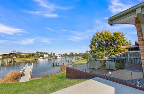Paynesville House | Step onto the spacious deck and drink in the mesmerizing views of the water