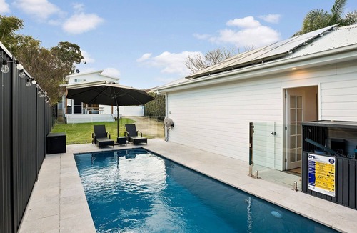 Warners Bay House | Stylish, private lakeside retreat complete with sparkling inground swimming pool. Sleeps 10.