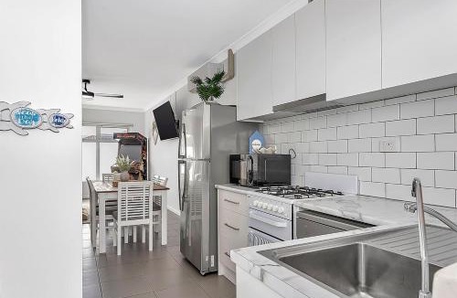 West Beach Apartment | Stylish Seaside Suite with Arcade and Balcony