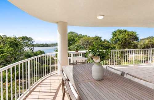 Currimundi Apartment | THE ENTRANCE UNIT 5 - Relax on a sunlit balcony overlooking Currimundi Lake, with birds singing in t
