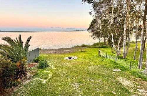 Gorokan House | The Pelican Palace Your Perfect Retreat Absolute waterfront, Stunning Clear Water View and Direct Access to water