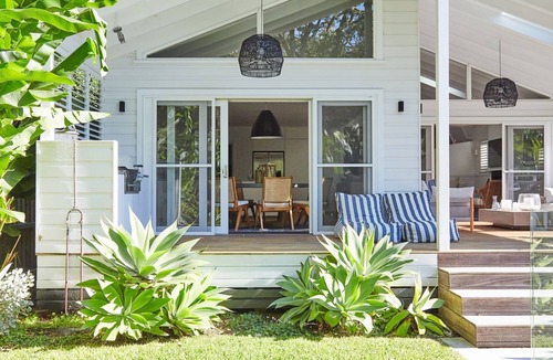Palm Beach House | This home matches quaint beachside charm with luxurious comfort.