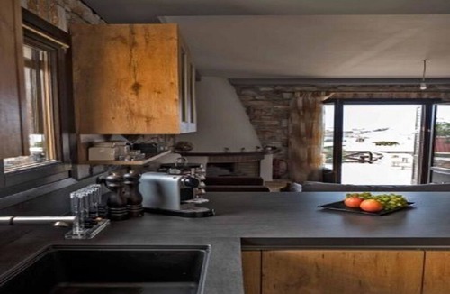 Megas Gialos Villa | Villa Camellia is a beautiful stone house overlooking the sea.