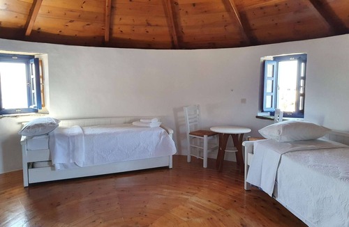 Tinos Town House | Windmill and houses by the sea // Stavros Bay