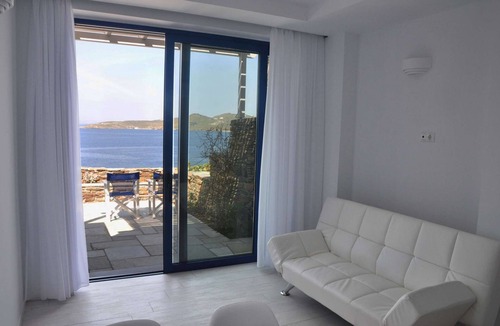 Tinos Town House | Windmill and houses by the sea // Stavros Bay