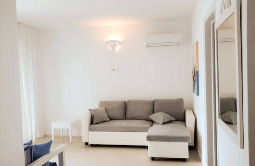 Tinos Town House | Windmill and houses by the sea // Stavros Bay