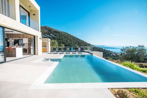 Villa Nissaki View 2 by Villa Plus in Vinglatoúrion