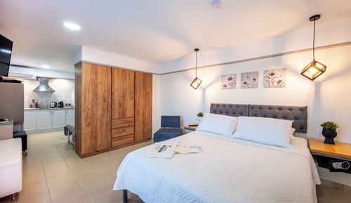 Deluxe Triple Room, Balcony, Garden View