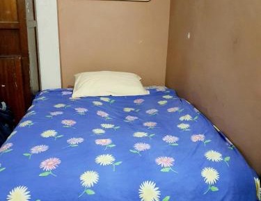 Single Bed in Dormitory Room